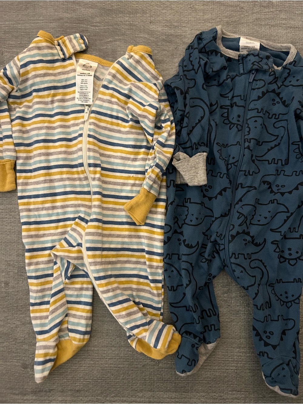 Set of 2 New born Gerber One-Piece Sleepers Sets.